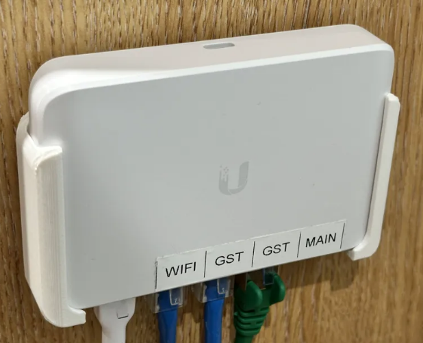 Dedykowany Uchwyt  Wieszak Montażowy do Switcha Ubiquiti UniFi Flex Mini Wspornik.png